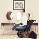 Image for article titled Today In WTF: Russian Socialite Poses On Chair Made Of A Black Woman